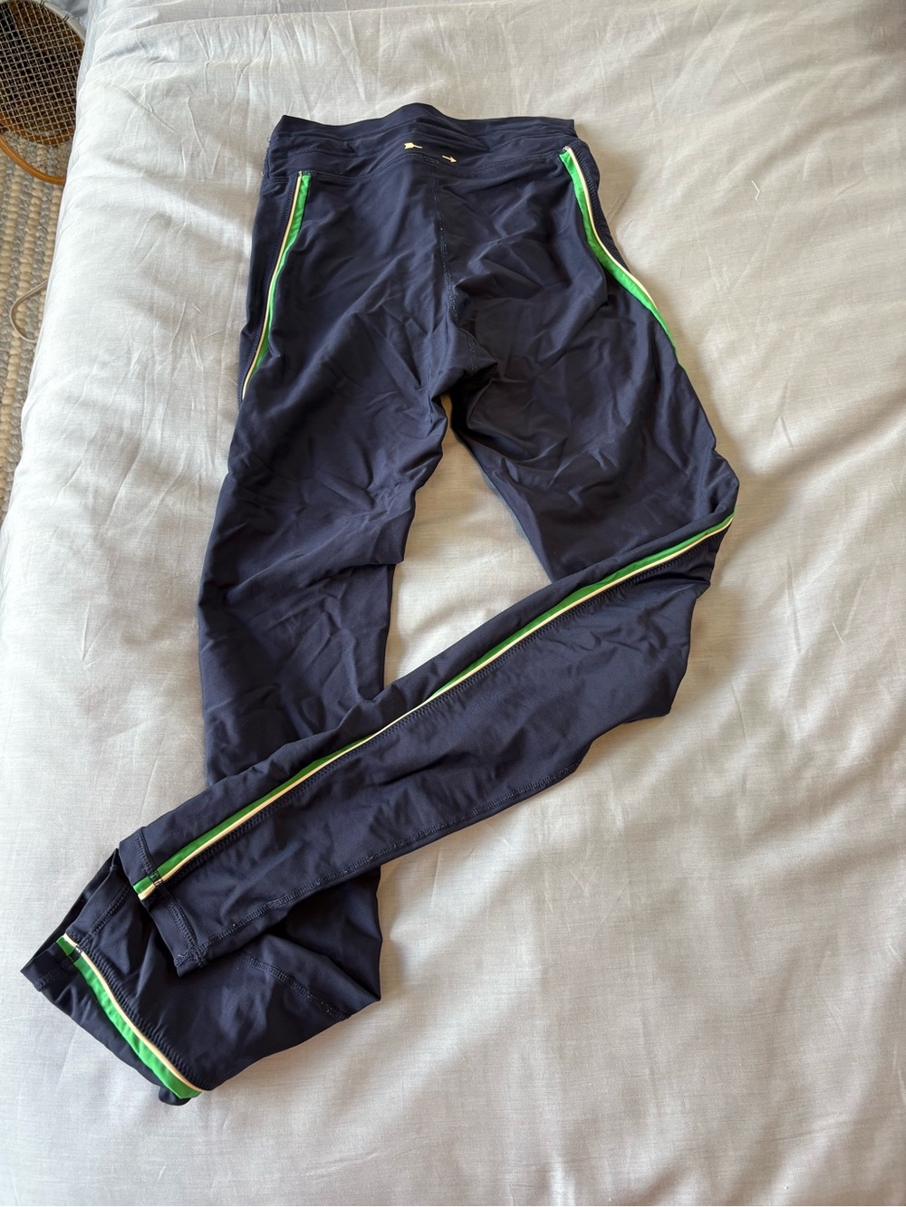 The Upside Navy Leggings with white and green racing stripe